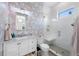 Modern bathroom with geometric wallpaper, glass shower, and white marble vanity at 2149 Bayou Grande Ne Blvd, St Petersburg, FL 33703