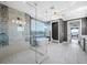 Bright bathroom with a large soaking tub, glass shower, and mosaic tiling at 2149 Bayou Grande Ne Blvd, St Petersburg, FL 33703