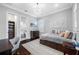 Bright bedroom featuring dark wood floors, a modern chandelier, and a cozy reading nook at 2149 Bayou Grande Ne Blvd, St Petersburg, FL 33703