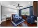 Charming bedroom with hardwood floors, comfortable chair, and colorful decor at 2149 Bayou Grande Ne Blvd, St Petersburg, FL 33703