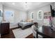 Bright bedroom featuring hardwood floors, many windows, and a cozy area for reading at 2149 Bayou Grande Ne Blvd, St Petersburg, FL 33703