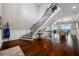 Spacious foyer with hardwood floors, grand staircase, and elegant decor at 2149 Bayou Grande Ne Blvd, St Petersburg, FL 33703
