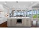 Spacious kitchen features double islands, stainless appliances, and seamless transition to outdoor living with water views at 2149 Bayou Grande Ne Blvd, St Petersburg, FL 33703