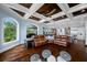 Open concept living room and kitchen with hardwood floors, large windows, and cozy furniture at 2149 Bayou Grande Ne Blvd, St Petersburg, FL 33703