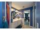 Well-maintained bathroom featuring a sink vanity and linen closet, creating a comfortable space at 2200 Marshall Dr, Dunedin, FL 34698
