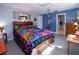 Bright bedroom featuring a spacious bed, tiled floors, and a calming color scheme at 2200 Marshall Dr, Dunedin, FL 34698