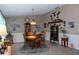 Cozy dining room with round wooden table and chairs, complemented by a vintage chandelier at 2200 Marshall Dr, Dunedin, FL 34698
