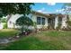 Well maintained single story home, featuring a beautifully landscaped yard and an inviting entrance at 2200 Marshall Dr, Dunedin, FL 34698
