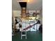 Well-organized garage with laundry machines, storage racks, and a drop down attic ladder at 2200 Marshall Dr, Dunedin, FL 34698