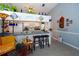Open kitchen with bar seating and a breakfast nook, ideal for casual dining and entertaining at 2200 Marshall Dr, Dunedin, FL 34698