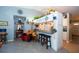 Bright and airy kitchen with bar seating, white cabinetry, and a cozy breakfast nook at 2200 Marshall Dr, Dunedin, FL 34698