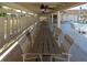 Covered outdoor dining area with tables and chairs, ideal for hosting gatherings by the pool at 2200 Marshall Dr, Dunedin, FL 34698