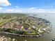 Wide aerial view of the neighborhood offering waterfront living with private boat docks and bay access at 2387 Hanover Dr # 2387, Dunedin, FL 34698