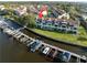 Aerial view showcasing a waterfront community with private boat docks and easy access to the open water at 2387 Hanover Dr # 2387, Dunedin, FL 34698