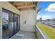 Balcony with canal view and sliding glass door access to the main living area at 2387 Hanover Dr # 2387, Dunedin, FL 34698