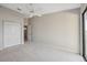 Spacious bedroom with a ceiling fan, double door closet, and glass sliding door for natural light at 2387 Hanover Dr # 2387, Dunedin, FL 34698