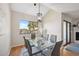 Dining area with modern table, bright window with water view, and elegant decor at 2387 Hanover Dr # 2387, Dunedin, FL 34698