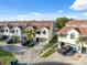An aerial exterior view of the condos offering private garages and meticulous landscaping at 2387 Hanover Dr # 2387, Dunedin, FL 34698