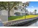 Condo with lush lawn, patio, mature trees and water view in this waterfront community at 2387 Hanover Dr # 2387, Dunedin, FL 34698