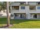 Townhouse exterior featuring a private patio overlooking the backyard and boat docks at 2387 Hanover Dr # 2387, Dunedin, FL 34698