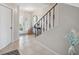 Inviting foyer with tile floors, an elegant staircase, and a welcoming entryway, showcasing the home's character at 2387 Hanover Dr # 2387, Dunedin, FL 34698