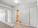 Hallway on the upper level of home leading to a bathroom and bedroom with closet at 2387 Hanover Dr # 2387, Dunedin, FL 34698