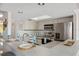 Kitchen with stainless steel appliances, modern lighting, skylight, and a breakfast bar with seating at 2387 Hanover Dr # 2387, Dunedin, FL 34698