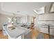 Bright kitchen with an island bar, ample counter space and an open floorplan at 2387 Hanover Dr # 2387, Dunedin, FL 34698