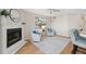 Cozy living room featuring a fireplace, bright decor, and comfortable seating at 2387 Hanover Dr # 2387, Dunedin, FL 34698