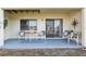 Covered patio area with seating and a view; perfect for outdoor relaxation and entertaining at 2387 Hanover Dr # 2387, Dunedin, FL 34698
