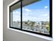 A window shows beautiful views of the water and docks, creating a serene and picturesque setting at 2387 Hanover Dr # 2387, Dunedin, FL 34698