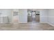 Spacious living area with slider door access to a lanai and backyard at 2551 Fentress Pl, Holiday, FL 34691