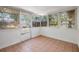 Enclosed sunroom with tile flooring and lots of windows at 2551 Fentress Pl, Holiday, FL 34691