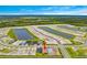 Community aerial view featuring homes next to ponds, showcasing its layout and design at 2760 Winding Creek Trl, North Port, FL 34289