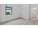 Bedroom with carpet, window and closet with sliding doors across the room at 2760 Winding Creek Trl, North Port, FL 34289