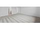 Large bedroom with neutral carpeting, a door leading to the bathroom, and plenty of space at 2760 Winding Creek Trl, North Port, FL 34289