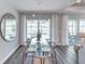 Bright dining room with large windows, perfect for entertaining guests with an open view of the pool at 2760 Winding Creek Trl, North Port, FL 34289