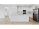 Open concept kitchen featuring a large island, modern appliances, and plenty of cabinet space at 2760 Winding Creek Trl, North Port, FL 34289