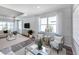 Cozy living room features comfortable seating and a wall-mounted TV for relaxation and entertainment at 2760 Winding Creek Trl, North Port, FL 34289