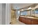 Bright bathroom featuring double vanity, granite countertops, and glass shower at 2837 Santego Bay Ct, Brandon, FL 33511