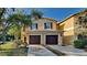 Two-story townhome with a two-car garage and manicured lawn at 2837 Santego Bay Ct, Brandon, FL 33511