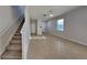 Open-concept living room featuring tile floors and a staircase at 2837 Santego Bay Ct, Brandon, FL 33511