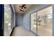 Screened-in patio with ceiling fans, sliding glass doors, and an outdoor view at 2837 Santego Bay Ct, Brandon, FL 33511