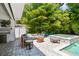 Private backyard area featuring lush greenery, pool with spa and a cozy seating area at 3607 W Roland St, Tampa, FL 33609