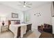 Bright bedroom with a comfortable bed, stylish furnishings, and neutral decor at 3607 W Roland St, Tampa, FL 33609