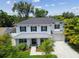 Beautiful two-story home featuring a large front porch and well-manicured landscaping, providing great curb appeal at 3607 W Roland St, Tampa, FL 33609