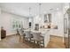 Bright kitchen with a large island, marble countertops, stainless steel appliances, and a bar seating area at 3607 W Roland St, Tampa, FL 33609
