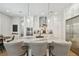 Bright kitchen with a large island, marble countertops, stainless steel appliances, and a bar seating area at 3607 W Roland St, Tampa, FL 33609