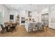 Modern kitchen with white cabinetry, stainless steel appliances, marble countertops, and pendant lighting at 3607 W Roland St, Tampa, FL 33609