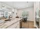 Spacious kitchen with a large island, stainless steel appliances, and an adjacent dining area at 3607 W Roland St, Tampa, FL 33609